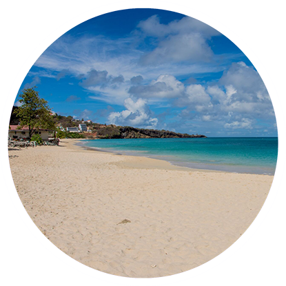 A beach in a circle with a blue sky and white sand, perfect for snorkeling in Grenada. A beach in a circle with a blue sky and white sand, perfect for snorkeling in Grenada.