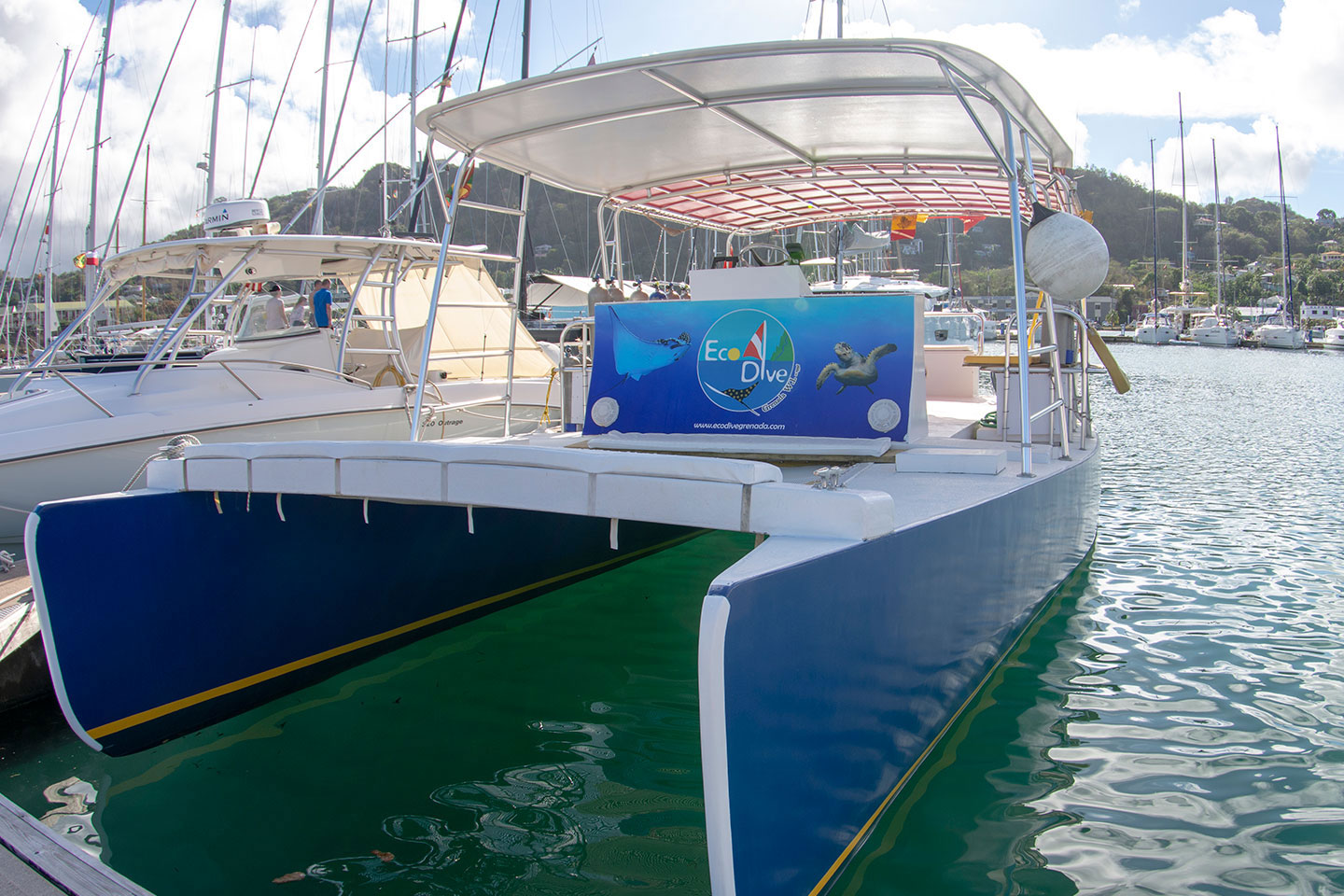 A boat docked in the water near Grenada’s famous underwater sculpture park. A boat docked in the water near Grenada's famous underwater sculpture park.
